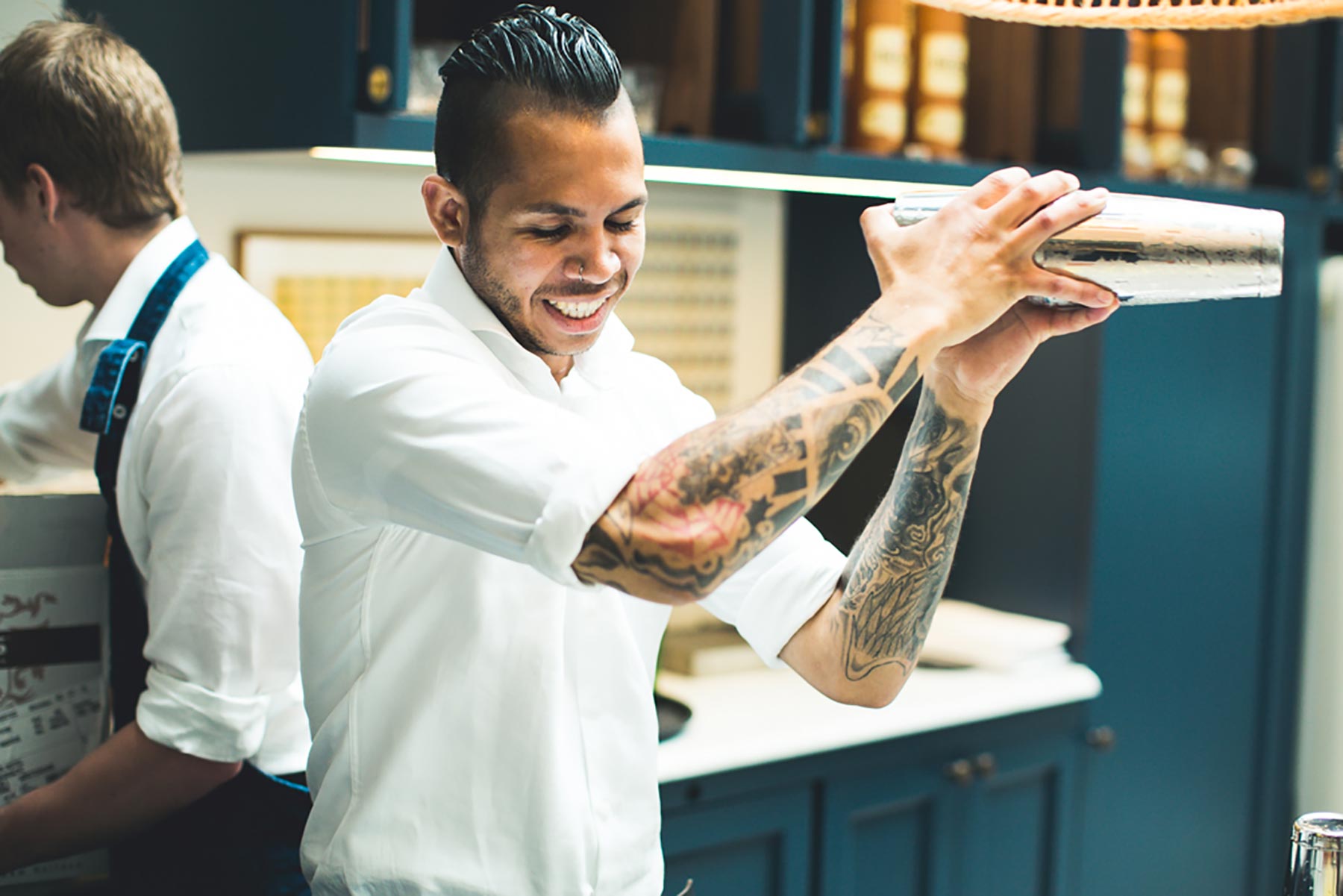 Bartender shacking a cocktail at an event