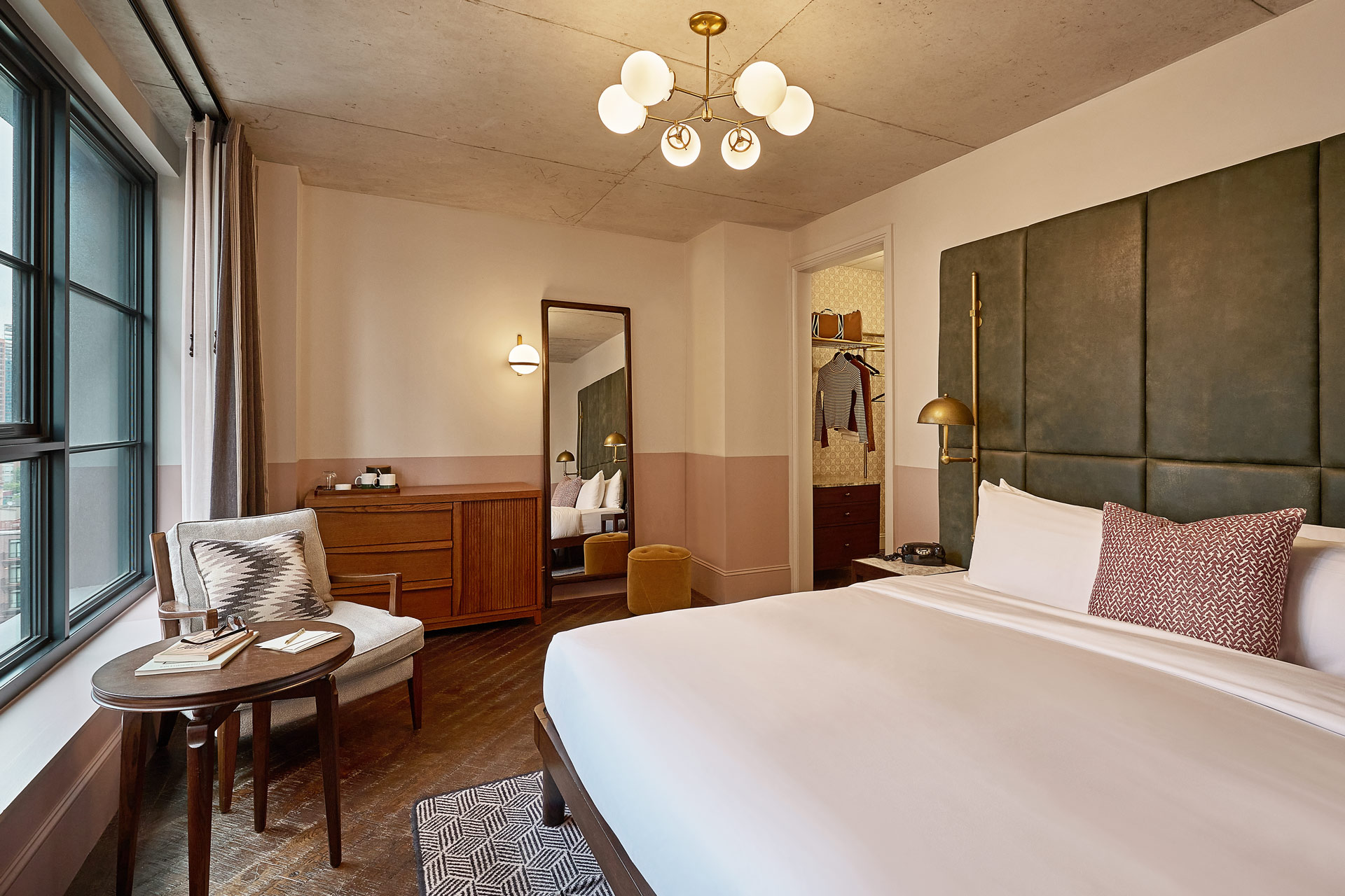 The Roomy bedrooms have a King sized bed with a dark grey coloured headboard