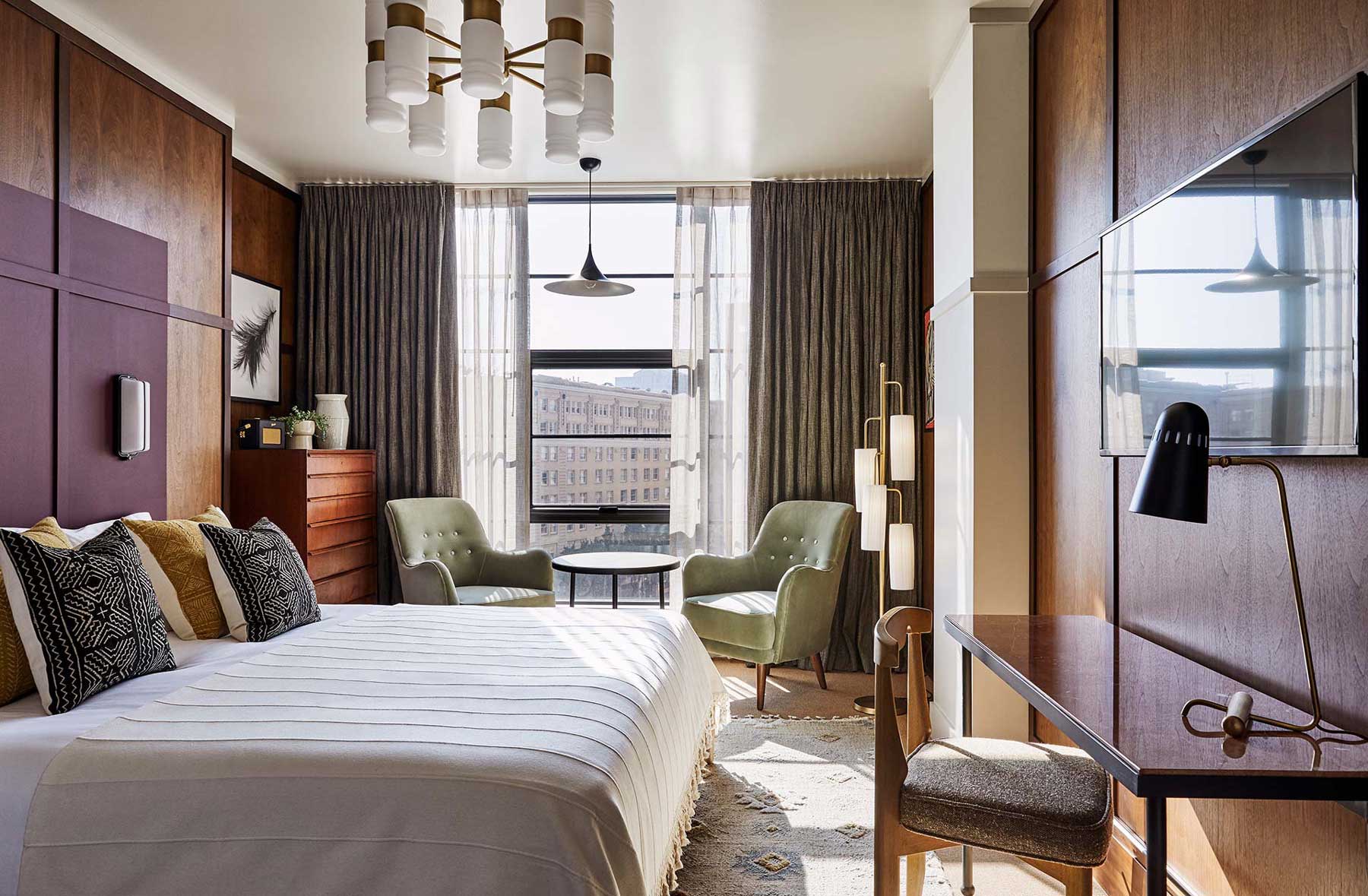 This is a large bedroom, with space for a desk, two lounge chairs, coffee table and a chest of drawers