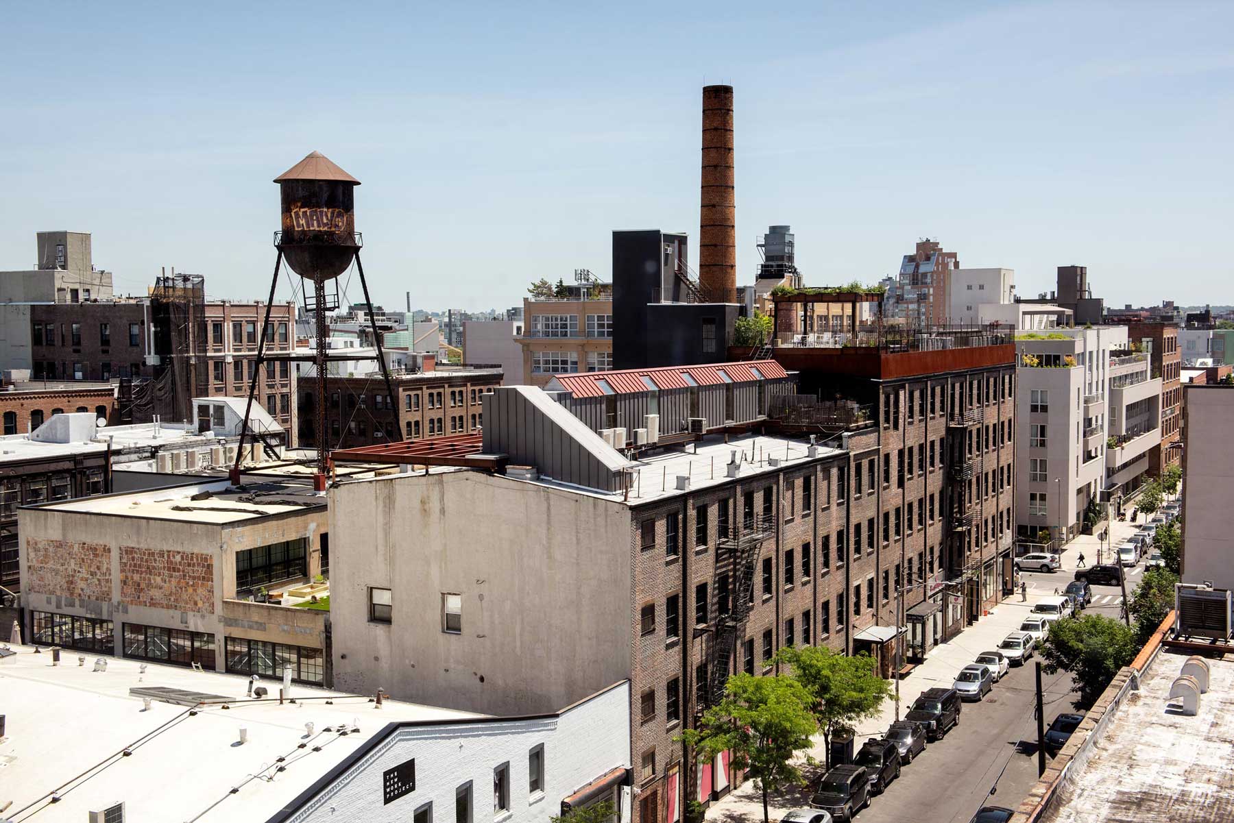 View of Brooklyn from the hotel, featuring clear blue skies and an old water tower