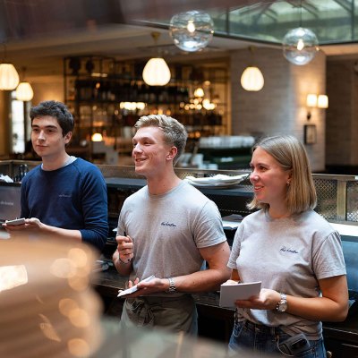 Three people working at a restaurant
