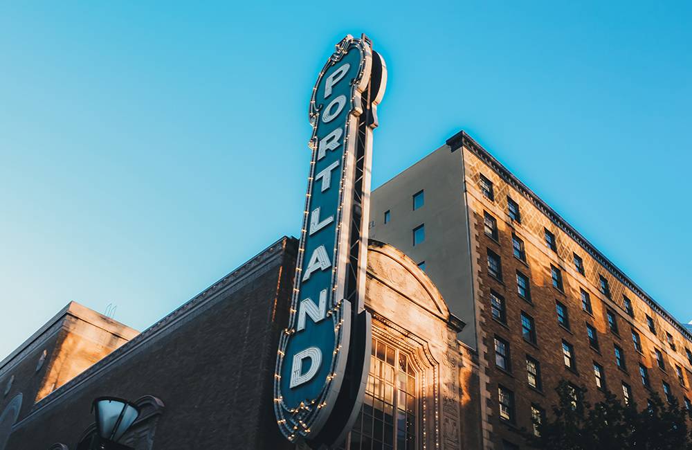 Portland sign on the side of a building with clear blue skies behind