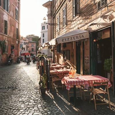 Pizzeria on a cobbled street in Rome