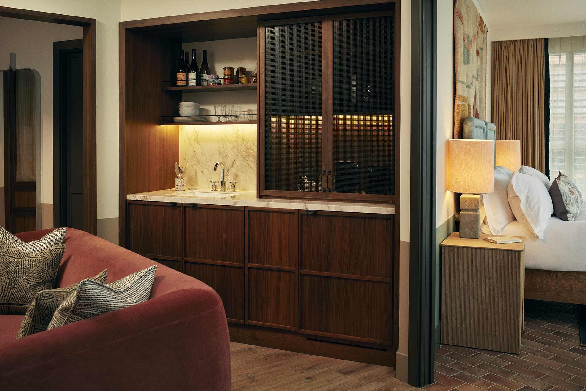 The pantry has shelves and cupboards for food, and a sink