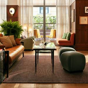 Stylish lobby with comfortable leather chairs and sunny windows in The Hoxton, Rome