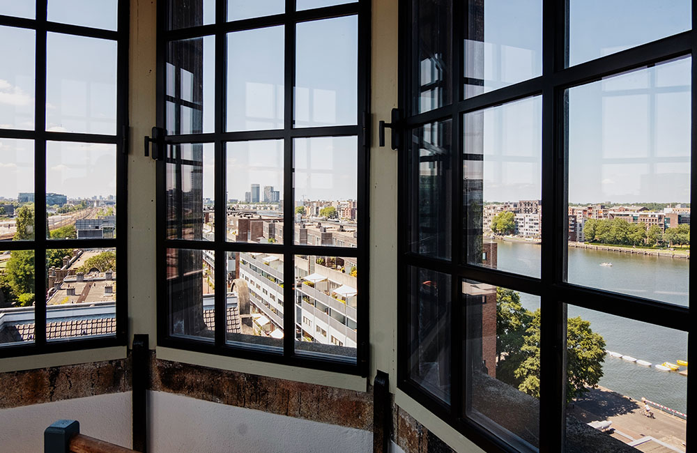 Mezzanine floor view of the city through large windows.