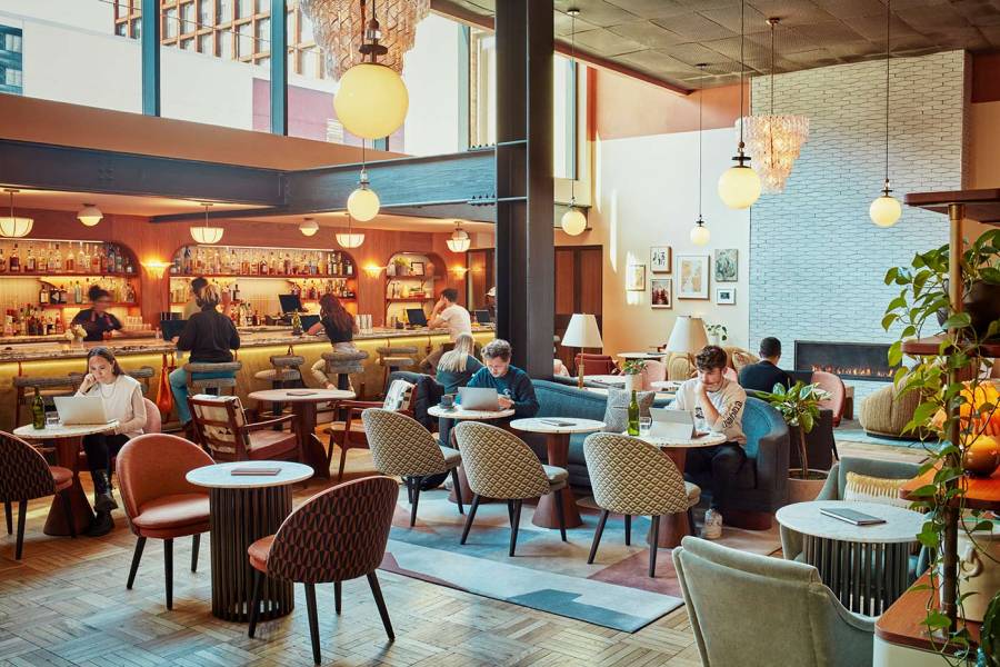 Lobby filled with natural light and places to eat at The Hoxton, Williamsburg.