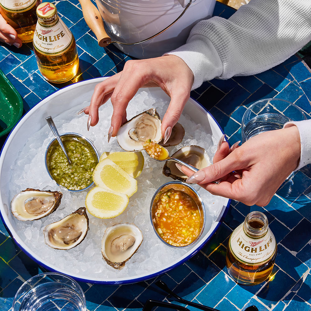 Oysters with lemon on a bed of ice.