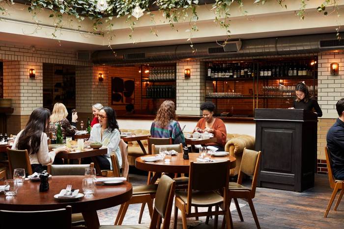 Interior view of the charming Lott's bar with natural light and bar behind.