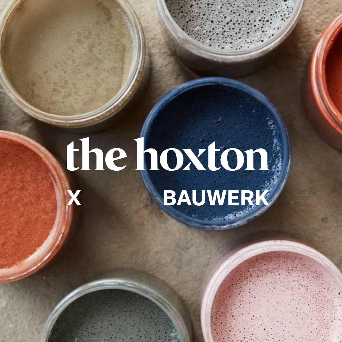 Bauwerk logo superimposed over cans of paint