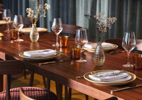 Close up of dining places on a polished wooden table
