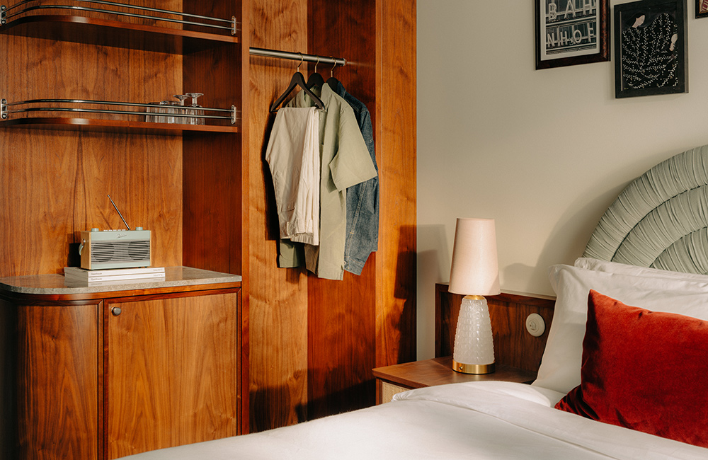View of large storage spaces and bedside in the cosy room.