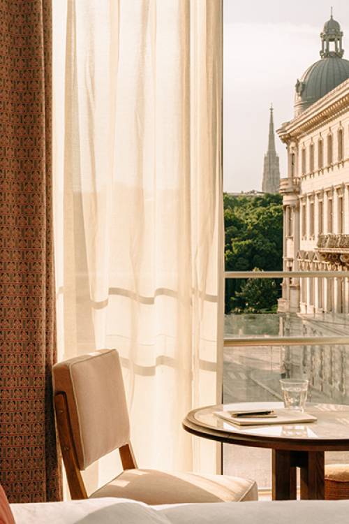 View of Vienna through an open window at Hoxton Vienna