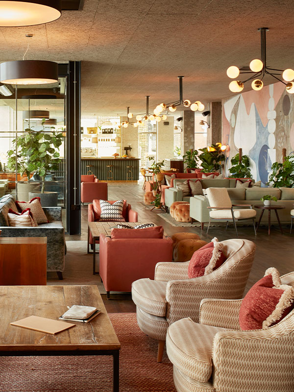 The Lobby with various comfortable seats at The Hoxton Holborn London.